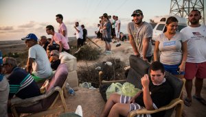 Issraelis gathered on a hilltop outside Sderot on Monday-AndrewBurton:Getty Images-NYT