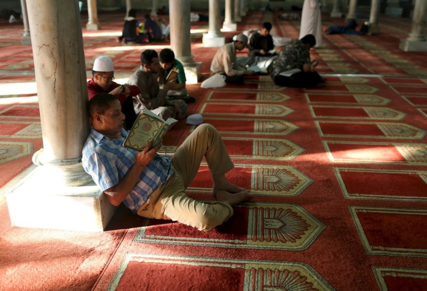 People read the Qur’an at a mosque during the first day of Ramadan in Cairo, Egypt. Asmaa Waguih / Reuters 