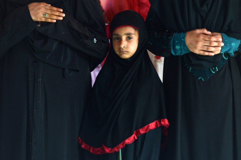 Kashmiri Muslim women are accompanied by a child as they pray during the first day of the month of Ramadan, at the Shah-i-Hamdaan shrine in Srinagar. Tauseef Mustafa / AFP / Getty Images 
