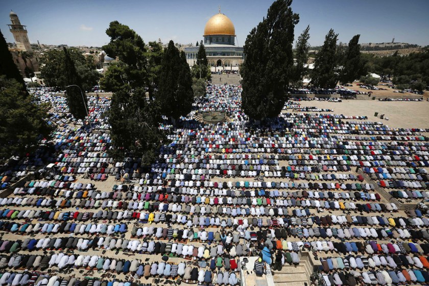 Palestinian Muslim worshipers pray outside the Dome of the Rock at the Al-Aqsa Mosque compound in Jerusalem during the first Friday prayer of the holy month of Ramadan. Israel announced it was relaxing restrictions on the movement of Palestinians to and from the West Bank and Gaza Strip, ahead of the Muslim holy month of Ramadan. Men aged over 40 and women of all ages from the West Bank will be able to pray at the Israeli-controlled holy site, and 800 people from the Gaza Strip will be allowed to attend Friday prayers.  Ahmad Gharabli / AFP / Getty Images
