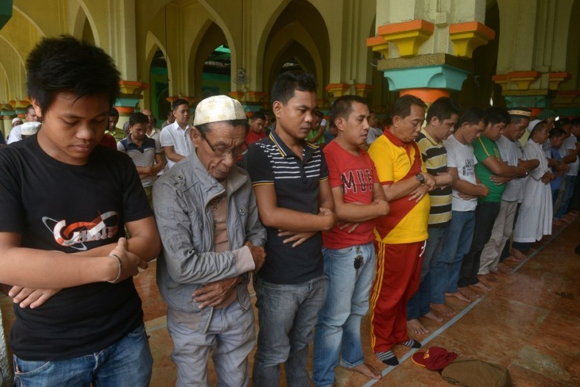 Filipino Muslims take part in prayers at the Golden Mosque in Manila. Jay Directo / AFP / Getty Images 